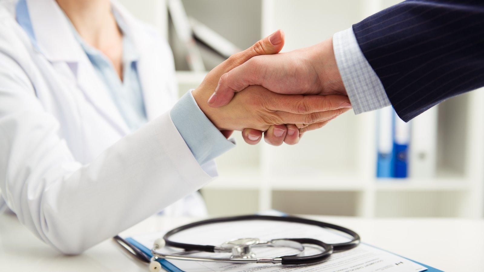 doctor and patient shaking hands